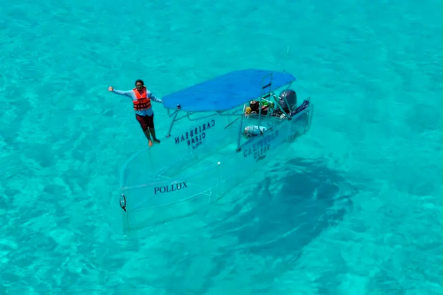 clear boat tour with reef visit and sandbar swim in Cancun